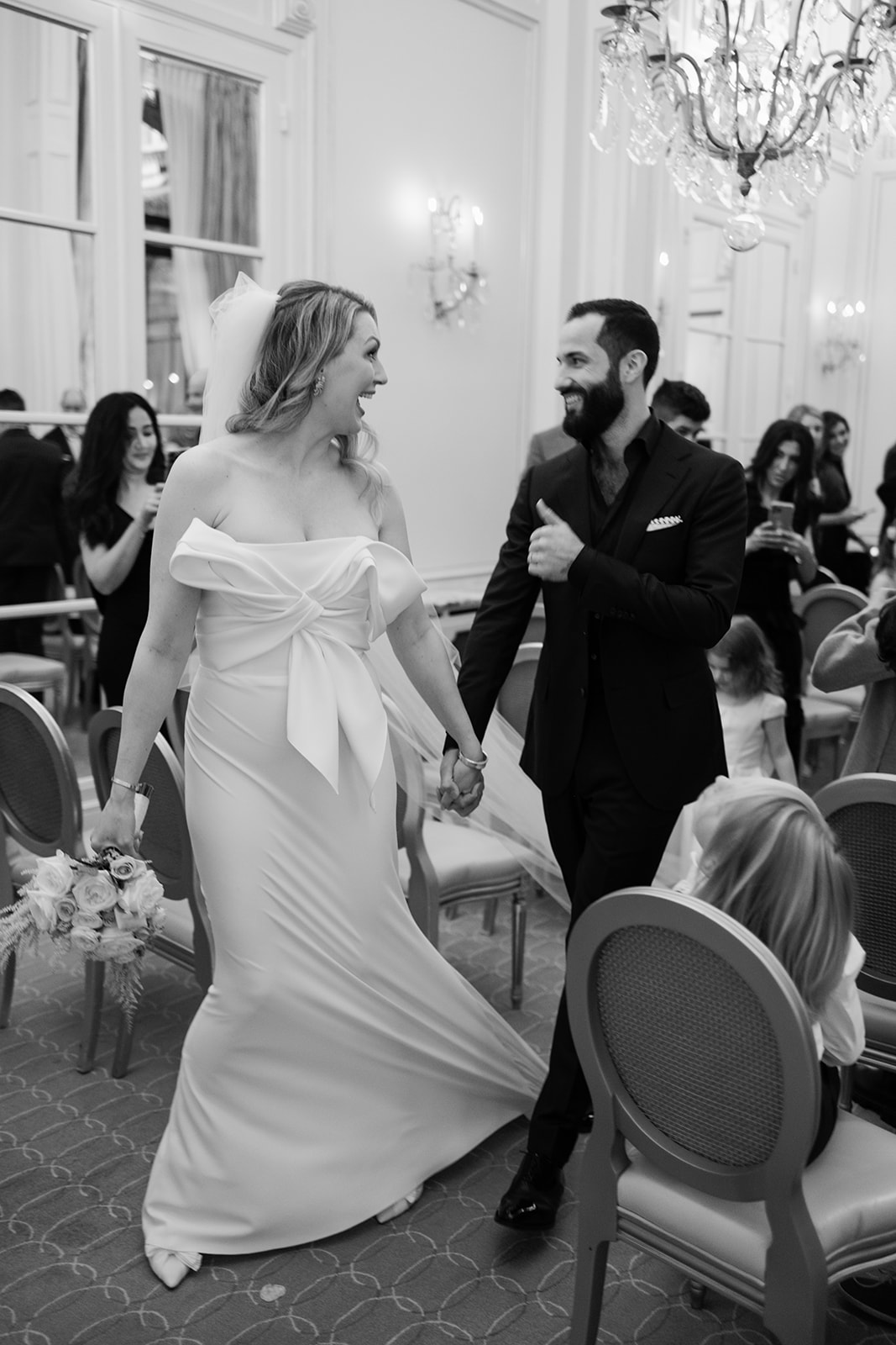 Bride and groom moving through the ceremony room at Hôtel Plaza Athénée